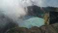 Aerial view of a two sided lake with a rock wall in the middle on top of a volcano. Kelimutu colored lakes Kootainuamuri Royalty Free Stock Photo