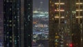Aerial view of apartment houses and villas in Dubai city near downtown night timelapse.