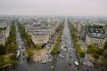 Aerial view of two streets of Paris with cars driving on the roads