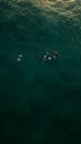 Aerial view of two surfers waiting patiently in the ocean for the perfect wave to come in Royalty Free Stock Photo