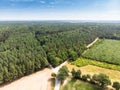 Aerial view of the typical landscape in northern Germany with an agricultural area bordering a piece of forest