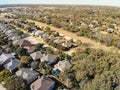 Aerial view typical Texas residential neighborhood in autumn wit