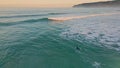 Aerial view unknown surfboarder enjoying ocean waves surfboard. Extremal surfer