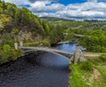 An aerial view up the River Spey over the castellated tower bridge at Craigellachie, Scotland