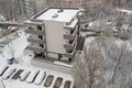 Aerial view of an urban apartment block in Bucharest, Romania, after a snow blizzard. Row of parked cars covered in snow Royalty Free Stock Photo