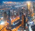 Aerial View Of Urban Background Of Illuminated Cityscape With Skyscrapers In Dubai. Street Night Traffic In Dudai Royalty Free Stock Photo