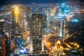 Aerial view of urban cityscape skyline at night. City background of illuminated cityscape with skyscrapers and towers in Royalty Free Stock Photo