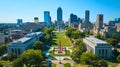 Aerial View of Urban Park with American Flag and City Skyline