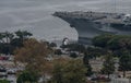 Aerial view of the USS Midway Aircraft Carrier`s bow and the Kissing Statue at the San Diego Museum, California Royalty Free Stock Photo