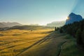 Aerial view of the valley in the fog during dawn in the Alpe di Suisi region. Dolomites in Italy in the fall