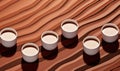 Aerial view of various assorted coffee cups on pastel minimalist theme background Royalty Free Stock Photo