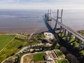 Aerial view of Vasco da Gama bridge crossing Tagus river and an industry water plant in foreground, Oriente district, Lisbon, Royalty Free Stock Photo