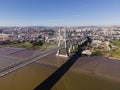 Aerial view of Vasco da Gama bridge crossing the Tagus river with Lisbon skyline