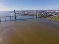 Aerial view of Vasco da Gama bridge with two pylons crossing the Tagus river with Lisbon skyline city centre in background, Royalty Free Stock Photo