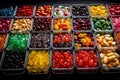 aerial View of vast array of different jelly bean flavors in open square containers,