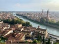 Aerial view of Verona, Italy. Historical city center, medieval buildings with red tiled roofs and bridges across Adige river. Royalty Free Stock Photo