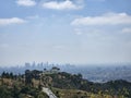 Aerial view of a vibrant cityscape of Los Angeles situated atop a lush hillside