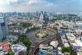 Aerial view of Victory Monument on busy street road. Roundabout in Bangkok Downtown Skyline. Thailand. Financial district center