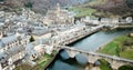 Aerial view of village of Estaing with medieval castle and gothique arched bridge across Lot river, Aveyron, France