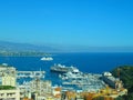 Aerial view from village La Turbie to Principality Monaco, Monte-Carlo, port Hercule, Prince Palace, Mountains, yachts, boats, sky Royalty Free Stock Photo