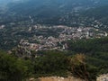 Aerial View of village Villagrande Strisaili with limestone rocks, mountains and green forest vegetation. Summer sunny