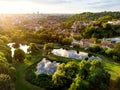 Aerial view of Vilnius cityscape shot from Subaciaus viewpoint on sunset. Clouds reflecting in three ponds of Lithuania capital`s Royalty Free Stock Photo