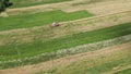 Aerial view vintage combine harvester mows wheat in field for food industry and Agribusiness farming
