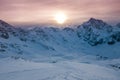 Aerial view of vivid beautiful sunset over snowy ski resort