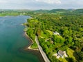 Aerial view of vivid emerald-green waters and scenic shore near Westport town along the Wild Atlantic Way, Ireland