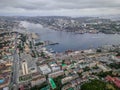The aerial view of Vladivostok downtown, the Golden Horn bay, the Golden Bridge, and Svetlanskaya street, in Russia