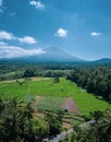 Aerial view of volcano and beautiful fields landscape during sunny summer day in Bali Royalty Free Stock Photo