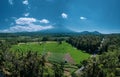 Aerial view of volcano and beautiful fields landscape during sunny summer day in Bali