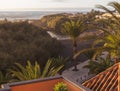 Aerial view of Vueltas at Valle Gran Rey, Main road with palm trees, apartments and sand baby beach Charco del Conde bay