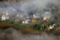 Aerial view of Waitsfield, VT in fog with church steeple on Scenic Route 100 in Autumn Royalty Free Stock Photo