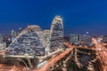 Aerial view of WangJing Soho at night, a famous landmark building in beijing city, designed by Zaha Hadid