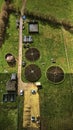 Aerial view of a wastewater treatment facility with circular tanks in a green field in North Yorkshire Royalty Free Stock Photo