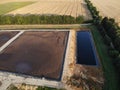 Aerial view of wastewater treatment plant at sunset, filtration of dirty or sewage water. Royalty Free Stock Photo