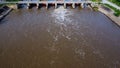 Aerial view of water released from the drainage channel of the concrete dam is a way of overflowing water in the rainy season. Top Royalty Free Stock Photo