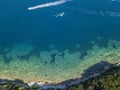 Aerial view of watercraft, jagged and lush coasts. Mediterranean scrub. Sveti Nikola, Budva island, Montenegro