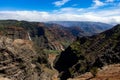 Aerial view of a waterfall in green mountains in Waimea Canyon State Park in Kauai County, Hawaii Royalty Free Stock Photo