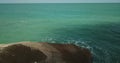 Aerial view of the waves that break on the stones