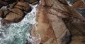 Aerial view of the waves that break on the stones