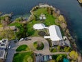 Aerial view of wedding reception ceremony setup with big white tents