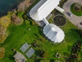 Aerial view of wedding reception ceremony setup with big white tents