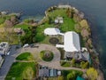 Aerial view of wedding reception ceremony setup with big white tents