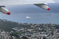 An aerial view of Wellington City and Harbour viewed from an aircraft window