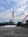 Aerial view of West Irian Liberation monument in downtown Jakarta with Jakarta cityscape. Jakarta, Indonesia, August 29, 2022 Royalty Free Stock Photo