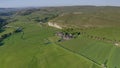 An aerial view of the Wharfedale valley, on the right is the limestone outcrop of Kilnsey crag, and the River Skirfare, right join