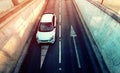 Aerial view of white car entering underground garage Royalty Free Stock Photo