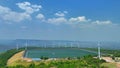 ..aerial view white cloud in blue sky above wind turbine on the top of mountain at sunset in Lam Takong Dam, Nakhon Ratchasima,